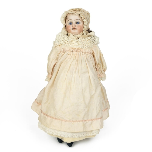 214 - Early 20th Century 11 inch JDK Germany doll, Bisque head and arms with composite body. retaining ori... 