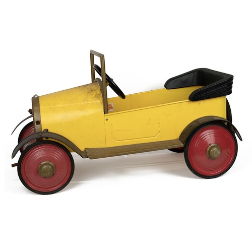 227 - A vintage Ragdoll Brum 2003 ride-on pedal car in yellow and red with pedals and crank handle, the nu... 