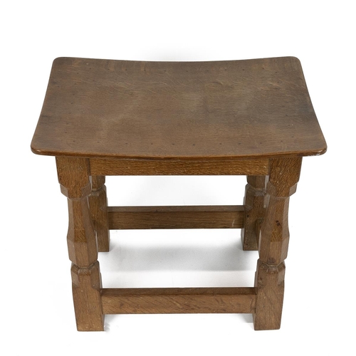 244 - Robert Mouseman Thompson, Kilburn: An English Oak Stool, with a solid top, on four octagonal legs jo... 