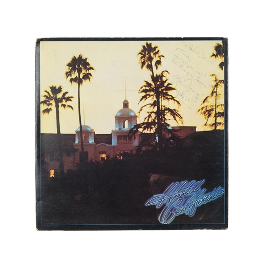 250 - Eagles - An original Eagles Hotel California LP vinyl album, with poster and the cover signed by Gle... 