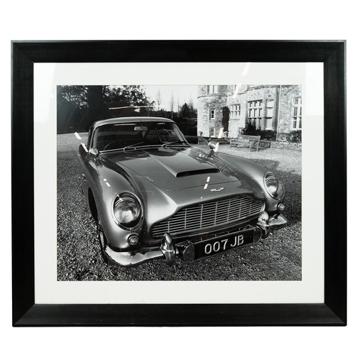 315 - James Bond Interest. Large Framed black and white photographic print of an Aston Martin DB7 with '00... 