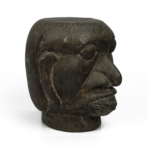 325 - A 20th-century solid carved wooden tribal ancestor head, 25cm high, 23cm wide. 