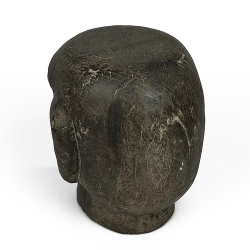 325 - A 20th-century solid carved wooden tribal ancestor head, 25cm high, 23cm wide. 