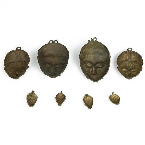 331 - West African miniature Baule masks - eight in total - ranging in size from 4.5cm to 13cm. (8)