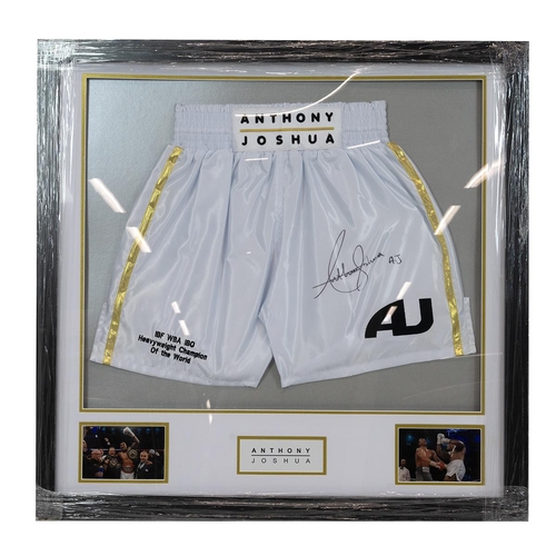 336 - Anthony Joshua - heavyweight boxing champion - A signed white boxing glove with a certificate of aut... 