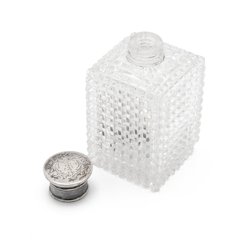 34 - Cut glass cologne flask with silver screw top of square form with diamond cut pattern. H 9.5cm.