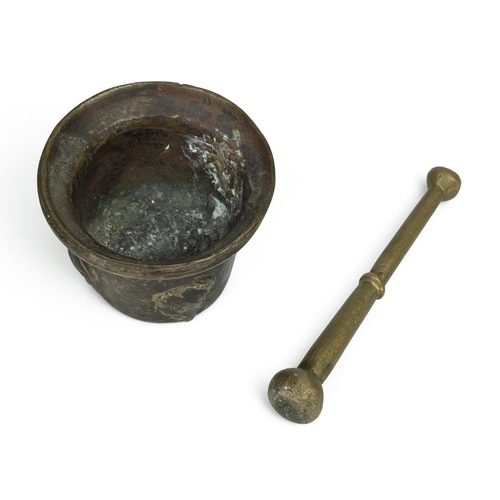 344 - 17th Century or earlier bronze apothecary's mortar with pestle. The heavily patinated bowl, which sh... 