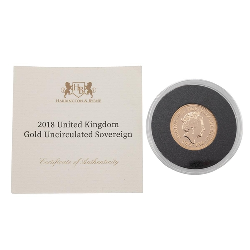 38 - A 2018 uncirculated full gold sovereign, in a plastic presentation case and a Harrington & Byrne cer... 