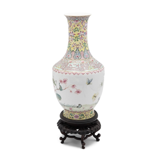 380 - A Chinese Republic Period (1911-1949) baluster shaped famille rose vase on wooden stand, decorated w... 