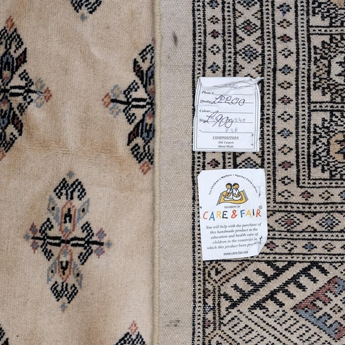 389 - Large Contemporary Bukhara pattern hand made rug. Cream/ Camel coloured ground with black geometric ... 