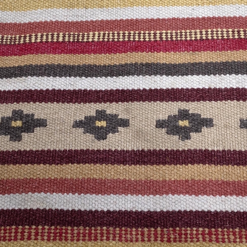 391 - Vintage kilim rug, hand-knotted with a multi-coloured ground, with repeating patterns throughout. 23... 