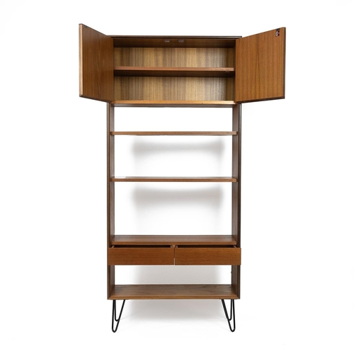 395 - Mid 20th Century G-Plan book case in teak, with three open shelves, cupboard with two doors above an... 