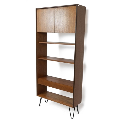 395 - Mid 20th Century G-Plan book case in teak, with three open shelves, cupboard with two doors above an... 