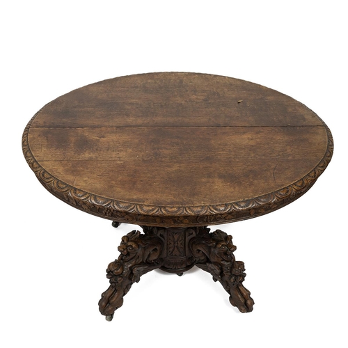 400 - Late 19th Century continental Oak oval centre table/ dining table with carved 'Green Man' Gothic det... 