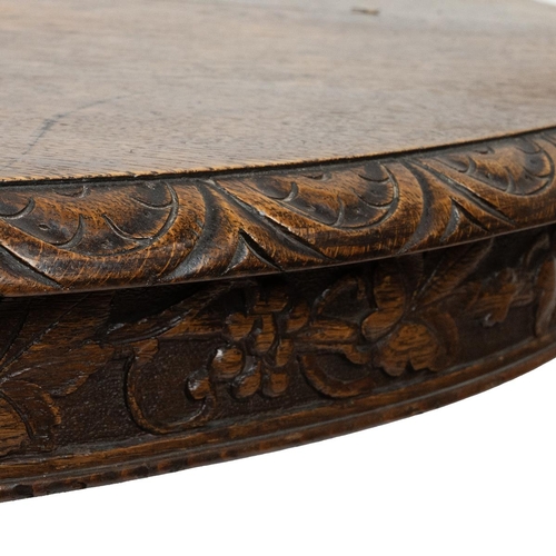 400 - Late 19th Century continental Oak oval centre table/ dining table with carved 'Green Man' Gothic det... 