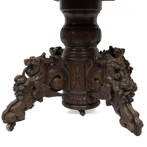 400 - Late 19th Century continental Oak oval centre table/ dining table with carved 'Green Man' Gothic det... 