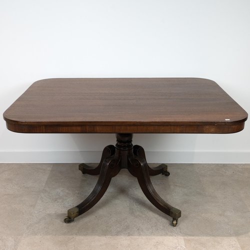 401 - Regency mahogany breakfast table with rectangular tilt top. Sweeping legs with fluted tops, on casto... 