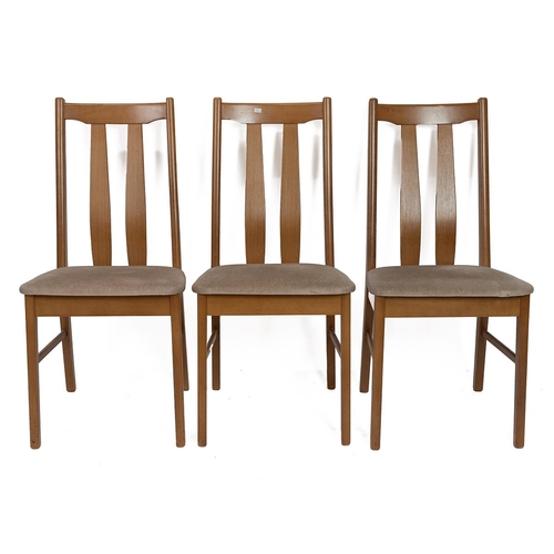 411 - Mid century Nathan beech wood extending dining table and four chairs with three additional chairs. H... 