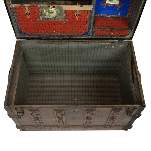 428 - 19th Century iron bound oak domed top trunk the leathered panelled lid opening to reveal a paper lin... 