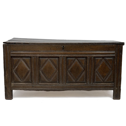 432 - Late 17th or early 18th Century oak coffer with four geometric carved panels to front, the  two plan... 