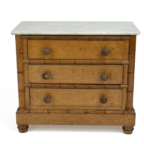 436 - An early 20th-century burr maple veneer apprentice chest of drawers, with a white marble top, faux b... 