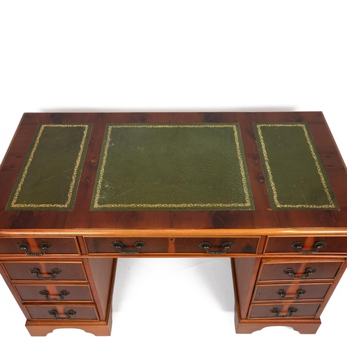 441 - Late 20th Century yew wood twin pedestal desk with tooled green leather top over six drawers and a c... 