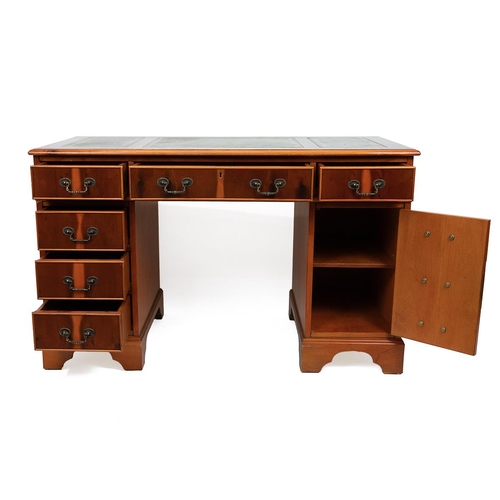 441 - Late 20th Century yew wood twin pedestal desk with tooled green leather top over six drawers and a c... 