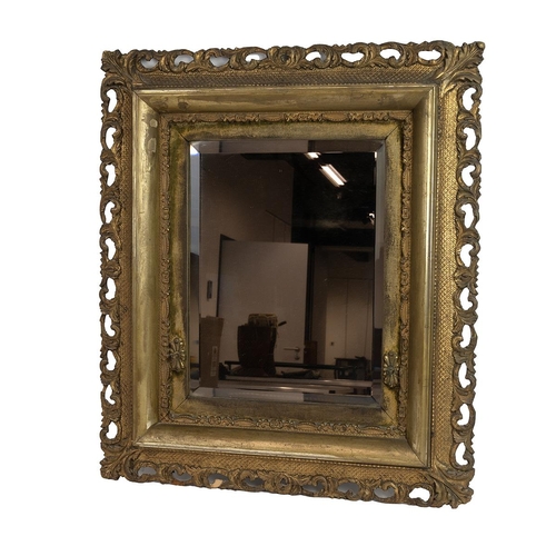 447 - A 19th-century gilt-framed mirror with a pierced border and bevelled mirror plate, 74cm x 63cm.