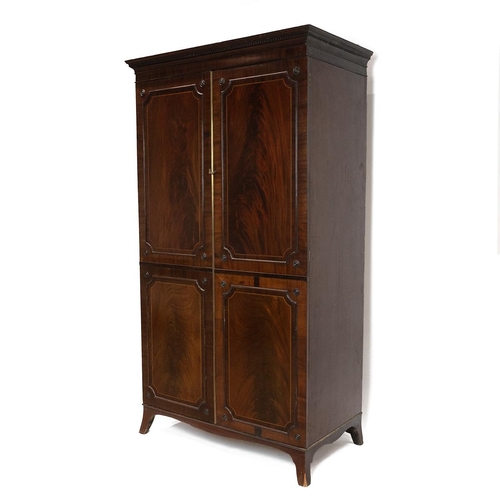 450 - Mid 19th Century flame mahogany single wardrobe, two panelled and inlaid doors with locking key open... 