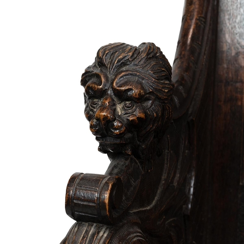 453 - Late 19th Century Flemish oak settle, heavily carved throughout. The back with three inset fielded p... 