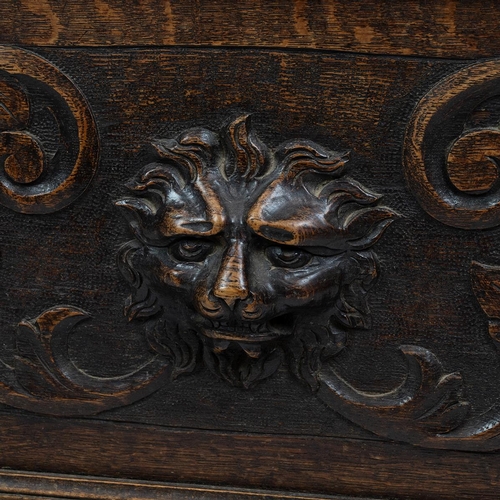 453 - Late 19th Century Flemish oak settle, heavily carved throughout. The back with three inset fielded p... 