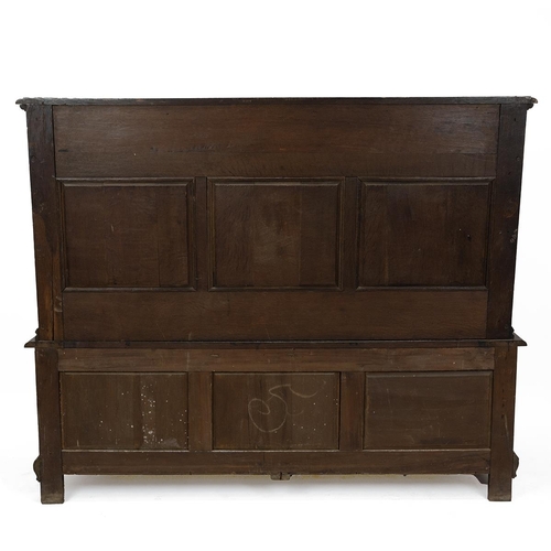 453 - Late 19th Century Flemish oak settle, heavily carved throughout. The back with three inset fielded p... 