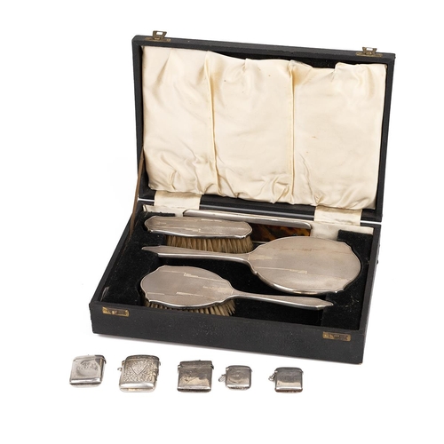 6 - A collection of five silver vesta cases, various dates and makers, and a silver-backed dressing tabl... 