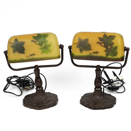 84 - Two vintage metal desk lamps with Galle glass style shades decorated with grapes and vines, the copp... 