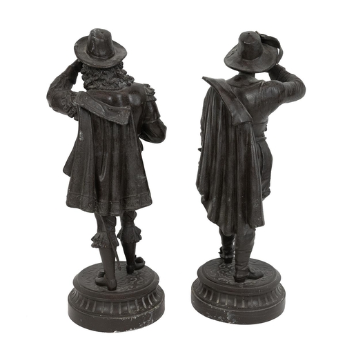 98 - Pair of Spelter figures of Cavaliers. Each standing on raised pedestal bases. Each H 47cm.