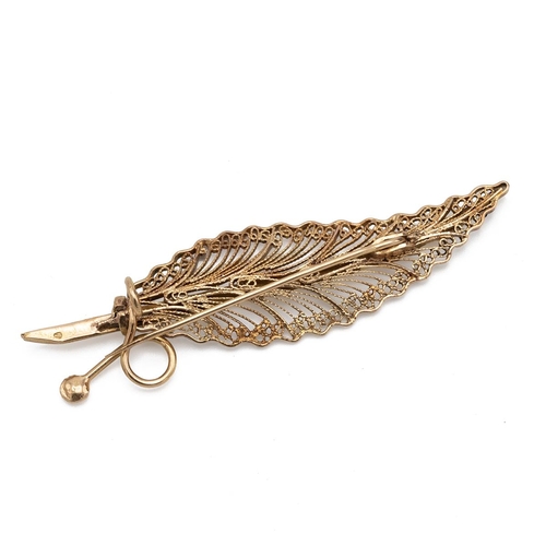 128 - 14ct gold brooch (tested), in the form of a New Zealand fern with filigree decoration weight 10.8g.