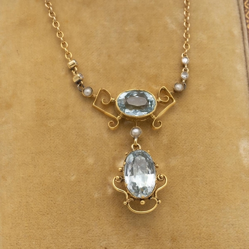 149 - Edwardian aquamarine, diamond and seed pearl pendant necklace, the closed backdrop with an oval cut ... 