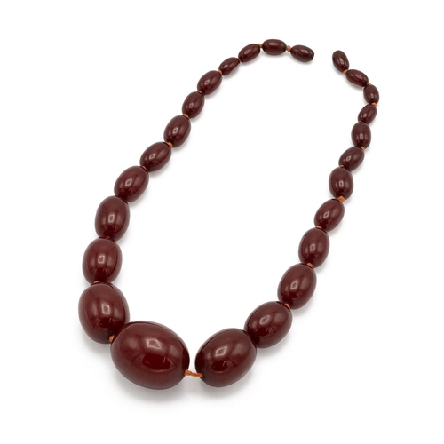 151 - Cherry amber bead necklace, set with graduated beads, 49cm long, 79.49g