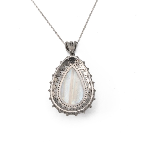 179 - A moonstone, sapphire and diamond pendant, the carved moonstone enclosed by small diamonds and sapph... 