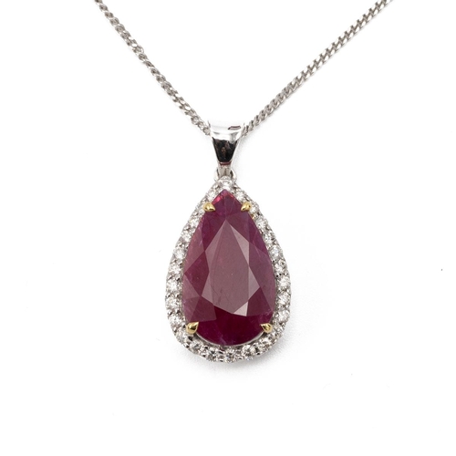 192 - Ruby and diamond pendant, the pendeloque cut stone measuring approximately 15 mm by 8.7 mm by 3 mm d... 