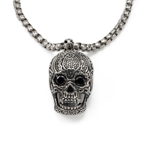 193 - A large skull pendant with stone-set eyes, on a chain, all in unmarked white metal. 