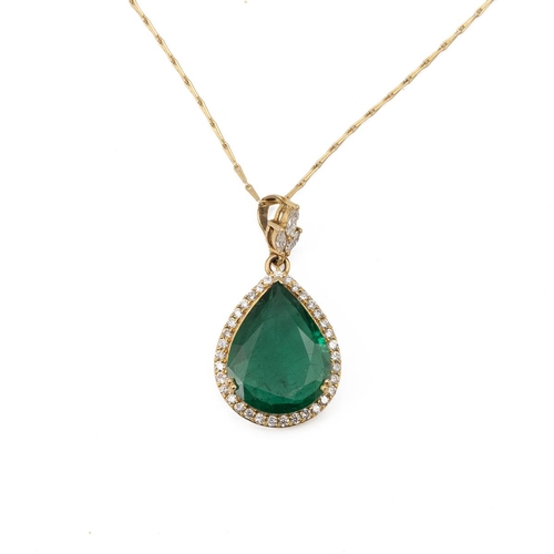 198 - An emerald and diamond pendant on a chain, the pendeloque cut stone measuring approximately 18.5 mm ... 