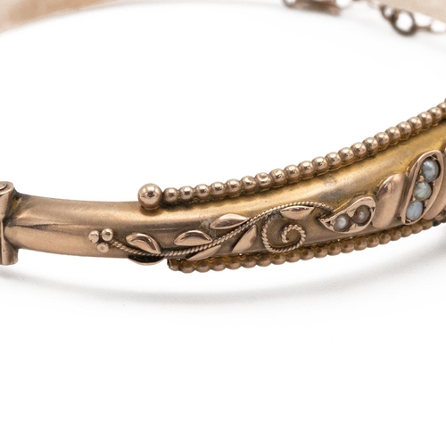 201 - Victorian 9ct gold and seed pearl bangle, hallmarked 9ct gold, 7.5g gross weight.