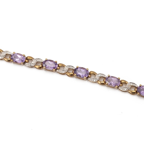 215 - A diamond and amethyst 9ct gold bracelet, the fourteen oval cuts with pairs of small single cuts bet... 