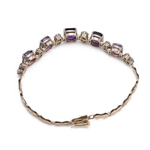 218 - An amethyst and white sapphire bracelet, in unmarked yellow metal, 17.5 cm long, 10g gross, possibly... 