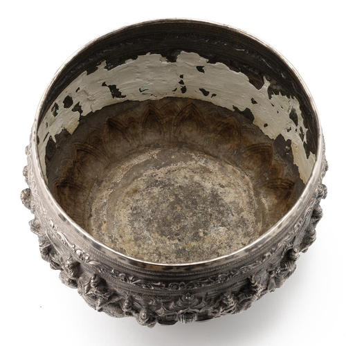 246 - Burmese late 19th-century silver bowl, embossed with various figures and buildings throughout, possi... 