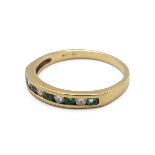 27 - A diamond and emerald 18ct gold half hoop ring, the alternating stones channel set, finger size R 1/... 