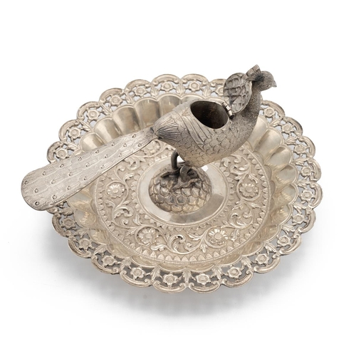 284 - 20th-century circuit Indian silver pierced dish, the peacock finial with a hinged lid, surrounded by... 