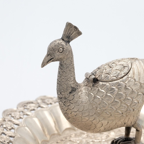 284 - 20th-century circuit Indian silver pierced dish, the peacock finial with a hinged lid, surrounded by... 