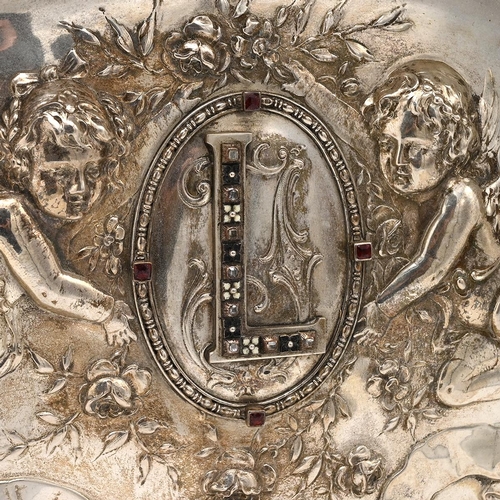 306 - A 19th century silver Hungarian marriage tray, decorated in relief with winged cherubs, the stylised... 